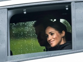 Britain's Prince Harry and his wife Meghan, Duchess of Sussex arrive for the unveiling of a plaque dedicating 20 hectares of native bush to the Queen's Commonwealth Canopy project at The North Shore Riding Club in Auckland on October 30, 2018. - Meghan Markle displayed an unexpected talent for "welly wanging" in Auckland on October 30, gaining bragging rights over husband Prince Harry after they competed in the oddball New Zealand sport.