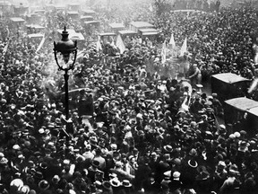 Parisians celebrate the signature Nov. 11, 1918 of the Armistice treaty ending the First World War.