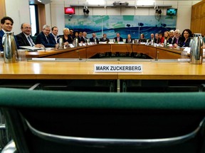 A handout photograph released by the UK Parliament on November 27, 2018 shows the International Grand Committee with representation from nine parliaments, a chair and the name plate for Facebook chief executive Mark Zuckerberg who was invited to give evidence, and declined the invitation, to the Digital, Culture, Media and Sport Committee investigation into disinformation and fake news at the Houses of Parliament in London on November 27, 2018. - Facebook boss Richard Allan is expected to be among a number of officials giving evidence to an "international grand committee" on disinformation and fake news. Allan will be questioned by British lawmakers and parliamentarians from Argentina, Brazil, Canada, Ireland, Latvia and Singapore during the special session in Westminster. The "unprecedented" move comes as the Commons Digital, Culture, Media and Sport Committee (DCMSC) probes fake news and the data breach that led to the Cambridge Analytica scandal.