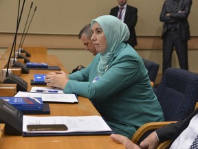 Bosnian Muslim politician Begija Smajic wearing a Muslim hijab head covering, attends an inaugural session of the Bosnian Serb parliament, in the Bosnian town of Banja Luka, 240 kms northwest of Sarajevo, Bosnia, on Monday, Nov. 19, 2018.  For the first time since Bosnia's ethnic war, a female politician Begija Smajic wearing Muslim dress has become a lawmaker in the parliament in the Serb half of the country.