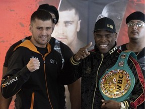 Adonis Stevenson, right, smiles as he faces contender Oleksandr Gvozdyk at the end of a news conference, Thursday, November 29, 2018 in Quebec City. WBC Light Heavyweight champion will fight Oleksandr Gvozdyk for the title.