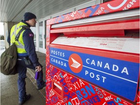 Canada Post workers return to work after the government ordered them to end their rotating strike Tuesday, November 27, 2018 in Montreal.