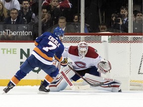Montreal Canadiens goaltender Antti Niemi makes the save against New York Islanders right-wing Jordan Eberle during the shootout on Nov. 5, 2018, in New York.