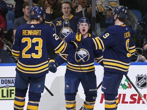 Sabres' Jeff Skinner is congratulated by Sam Reinhart and Jack Eichel after tying the game late in the third period Friday evening in Buffalo.