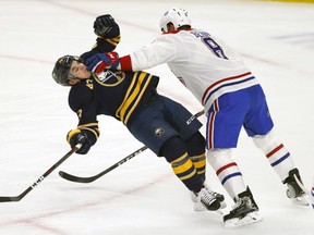 Canadiens defenceman Jordie Benn lays out Sabres forward Conor Sheary during first period Friday night in Buffalo.