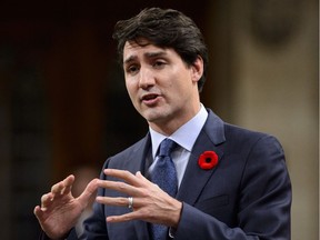 Prime Minister Justin Trudeau stands during question period in the House of Commons on Parliament Hill in Ottawa on Wednesday, Nov. 7, 2018. In an interview with L'Actualité, Trudeau said, “I will defend the rights and freedoms of all, even if it’s unpopular,” but also said he didn't want to "to lead a political battle.”