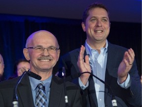 Conservative Leader Andrew Scheer, right, applauds Richard Lehoux, candidate in the Beauce riding, Saturday, November 3, 2018 in St-Elzear Que. Lehoux, who was mayor of St-Elzear and president of the Federation Quebecois des Municipalites will run against Maxime Bernier in next year's federal election.