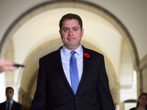 Conservative Leader Andrew Scheer makes his way to speak to media on Parliament Hill, in Ottawa, Wednesday, Nov. 7, 2018.