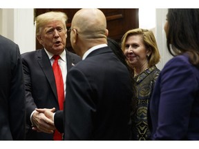 Deputy National Security Adviser Mira Ricardel, right, watches as President Donald Trump arrives for a Diwali ceremonial lighting of the Diya in the Roosevelt Room of the White House, Tuesday, Nov. 13, 2018, in Washington. In an extraordinary move, first lady Melania Trump is publicly calling for the dismissal of Ricardel. After reports circulated that the president had decided to remove Ricardel, the first lady's spokeswoman issued a statement saying: "It is the position of the Office of the First Lady that she no longer deserves the honor of serving in this White House." Ricardel is national security adviser John Bolton's deputy.