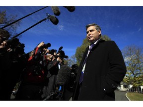 CNN's Jim Acosta speaks to journalists on the North Lawn upon returning back to the White House in Washington, Friday, Nov. 16, 2018. U.S. District Court Judge Timothy Kelly ordered the White House to immediately return Acosta's credentials. He found that Acosta was "irreparably harmed" and dismissed the government's argument that CNN could send another reporter in Acosta's place to cover the White House.