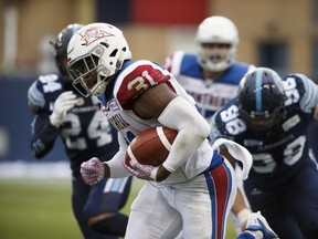 Montreal Alouettes running-back William Stanback carries the ball up field during first half against the Argonauts in Toronto on Oct. 20, 2018.