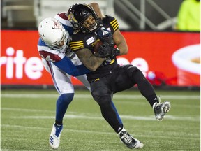 Montreal Alouettes linebacker Glenn Love tackles Hamilton Tiger-Cats running-back Sean Thomas Erlington during second half in Hamilton on Nov. 3, 2018.