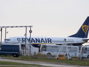 A Ryanair plane sits on the tarmac at the Bordeaux-Merignac airport in southwestern France, after being impounded by French authorities, Friday, Nov. 9, 2018. Storms, strikes, computer failures _ you can now add "your plane has been seized by the government" to the list of things that can delay your flight. (AP Photo) ORG XMIT: REB108