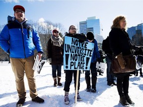 University student Camille Caron, centre, joins the crowd of Franco-Ontarians outside of Queen's Park in Toronto calling for a new francophone university on Thursday, February 18, 2016.