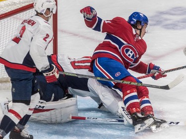 Charles Hudon falls onto Washington Capitals goaltender Braden Holtby during first-period action at the Bell Centre on Thursday, Nov. 1, 2018.