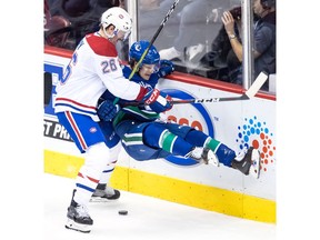 Canadiens' Jeff Petry checks Canucks' Brendan Leipsic in Vancouver on Saturday, Nov. 17, 2018.