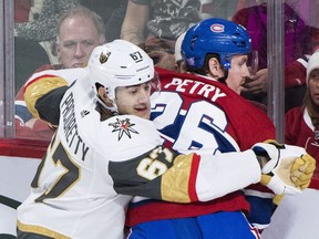 Vegas Golden Knights forward Max Pacioretty checks Canadiens' Jeff Petry at the Bell Centre in Montreal on Saturday, Nov. 10, 2018.