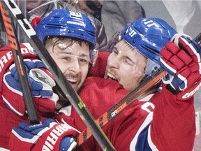 Canadiens' Tomas Tatar (90) celebrates with teammate Brendan Gallagher after scoring against the Vegas Golden Knights in Montreal on Saturday, Nov. 10, 2018.