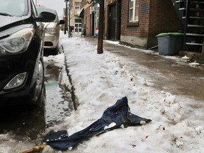 A pair of jeans are soaked in the snow near the scene of a homicide on Nicolet St. near Ontario St. in Montreal Nov. 28, 2018.