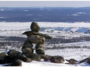 An Inukshuk overlooks the town of Kuujjuaq. As families continue lose children to suicide, an online petition is calling for the federal government to declare a state of emergency.