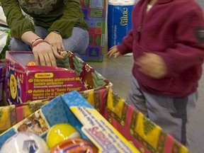 Volunteering can be a formative experience for children. Even the very young can help pack holiday hampers, Fariha Naqvi-Mohamed says, and the activity provides an opportunity for parents to discuss why it’s important to help those less fortunate.