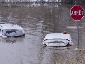 Cars under water near the Atwater Tunnel in Montreal, Nov. 20, 2018, after a water pipe was accidentally cut.