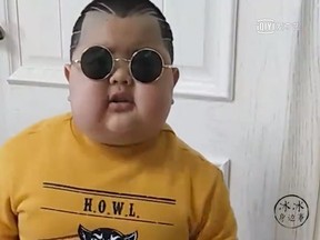 A Chinese boy, nicknamed "Little Rock," has become an internet sensation thanks to the live stream videos he shares online. (iqiyi.com screengrab)