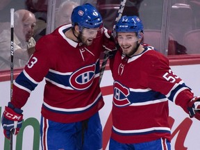 Canadiens' Michael Chaput, left, celebrates Victor Mete's goal with the defenceman during pre-season action at the Bell Centre.