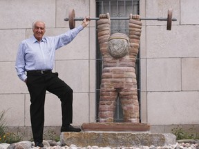 Harry Rosen, a Montreal dentist, with a sculpture called Little Hercules, which he donated to the Montreal Children's Hospital.