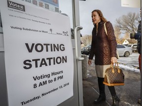 A Calgarian arrives to vote in a plebiscite on whether the city should proceed with a bid for the 2026 Winter Olympics, in Calgary, Alta., Tuesday, Nov. 13, 2018.THE CANADIAN PRESS/Jeff McIntosh ORG XMIT: JMC106