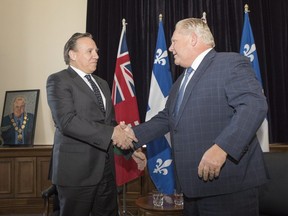 Quebec Premier François Legault, left, meets with Ontario Premier Doug Ford in Toronto on Monday, Nov. 19, 2018. After the two-hour session, Legault said he had expressed disappointment with the Ford government's recent decisions regarding Ontario's francophone community.