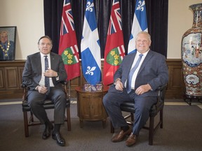 Quebec Premier François Legault, left, meets with Ontario Premier Doug Ford at Queens Park in Toronto on Monday, Nov. 19, 2018.