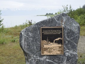 In this photo taken July 14, 2018, is a 10,000-pound rock memorial that remembers the 1918 sinking of the Princess Sophia near Juneau, Alaska. A memorial has been placed on a beach northwest of Juneau to remember the Canadian passenger liner that sank a century ago, killing about 350 people. Juneau members of Pioneers of Alaska dedicated a slab of granite and quartz at Eagle Beach State Recreation Area to remember the sinking of the SS Princess Sophia, the Juneau Empire reported. (Kevin Gullufsen/Juneau Empire via AP) ORG XMIT: AKJUN501