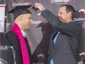 Former Montreal Canadiens player Steve Begin, left, has his tassel adjusted by Quebec Education Minister Jean-François Roberge as he receives his high school diploma Thursday, Nov. 8, 2018 in Montreal.