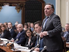 Quebec Premier Francois Legault stands to respond during question period Thursday, November 29, 2018 at the legislature in Quebec City.
