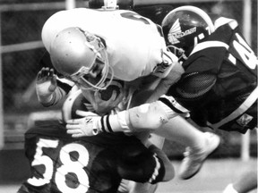 McGill Redmen take down an opponent during a Sept. 21, 1991 football game in Montreal. "Regardless of the originally intended meaning of 'Redmen,' the connection was made in the press and by those at the university for decades, starting in the 1920s. Those connotations cannot now be declared void by the university or its alumni," Patricia Johnson-Castle and Janelle Bruneau write.