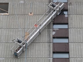 The Montreal fire department had to rescue construction workers who were dangling by their safety harnesses after the scaffold they were working on partially collapsed on Cavendish Blvd. Nov. 8, 2018.