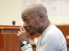 FILE - In this Aug. 10, 2018 file photo, Dewayne Johnson reacts after hearing the verdict in his case against Monsanto at the Superior Court of California in San Francisco. A Northern California groundskeeper says he will accept a judge's reduced verdict of $78 million against Monsanto after a jury found the company's weed killer caused his cancer. DeWayne Johnson's attorney informed the San Francisco Superior Court on Wednesday, Oct. 31, 2018. (Josh Edelson/Pool Photo via AP, File) ORG XMIT: FX304
