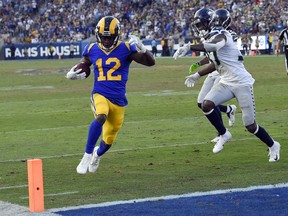 Los Angeles Rams wide receiver Brandin Cooks scores against the Seattle Seahawks during the second half in an NFL football game Sunday, Nov. 11, 2018, in Los Angeles.