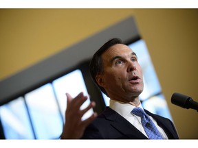 Finance Minister Bill Morneau holds a press conference in the media lockup for the fall economic update, in Ottawa on Wednesday, Nov. 21, 2018.