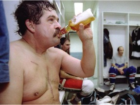 Randy Tieman chats with the guys after hockey at Lower Canada College in 1996.