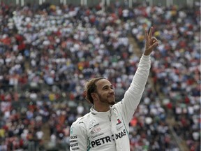 Lewis Hamilton celebrates his fifth F1 drivers' championship at the Mexican Grand Prix.