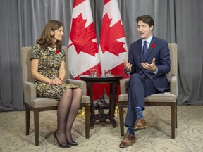 Prime Minister Justin Trudeau meets with Isabelle Marcoux, chair of the board of Transcontinental Inc. Ion Monday, Nov, 5, 2018 in Montreal.