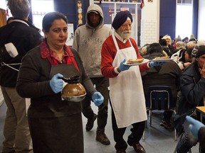 Members of Montreal's Sikh community help serve the 2012 Christmas lunch they sponsored at the Old Brewery Mission.