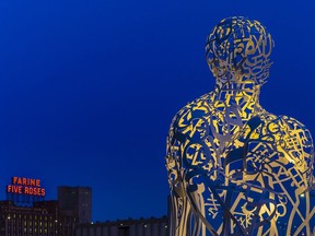 Source by Spanish (Catalan) artist Jaume Plensa appears to look toward the Farine Five Roses sign.