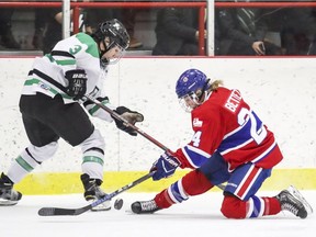 Les Canadiennes' Ann-Sophie Bettez falls to one knee while stickhandling against Markham Thunder's Jocelyne Laroque during first period of Canadian Women's Hockey League playoff game in Montreal on March 16, 2018.