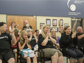 The audience at a meeting of the Lester B. Pearson School Board expresses approval after the board voted to keep Lakeside Academy open on Monday, June 27, 2016, in response to a groundswell of support for the school. Fariha Naqvi-Mohamed also found the board to be responsive when she was among parents who had a problem with school bus rezoning, and the board listened and overturned the change.