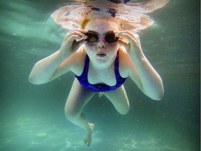 I was assigned to photograph Olivia Lavallee at her home on the South Shore for a sports column by Stu Cowan about her swimming in the World Down Syndrome Championship in Nova Scotia. I hoped I'd be able to get a photo of her in a pool, so I made sure my GoPro camera had a full charge. But the only place to get her in water was in the family's above-ground pool in their backyard. I had Olivia swim back and forth across the round pool, sticking the underwater camera in the water and firing as many frames as I could without being able to see exactly what the camera was capturing. At one point, Olivia stopped to reposition her swim goggles and that made the best frame.