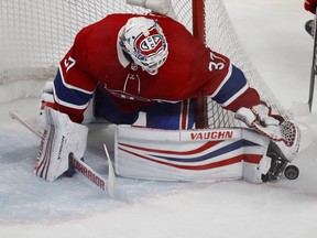 Montreal Canadiens goaltender Antti Niemi reaches to get his glove over the puck against the Detroit Red Wings in Montreal on Oct. 15, 2018.