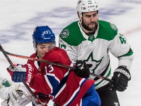 Dallas Stars defenceman Roman Polak gets his stick up against Canadiens' Max Domi at the Bell Centre in Montreal on Oct. 30, 2018. The Stars won 4-1.